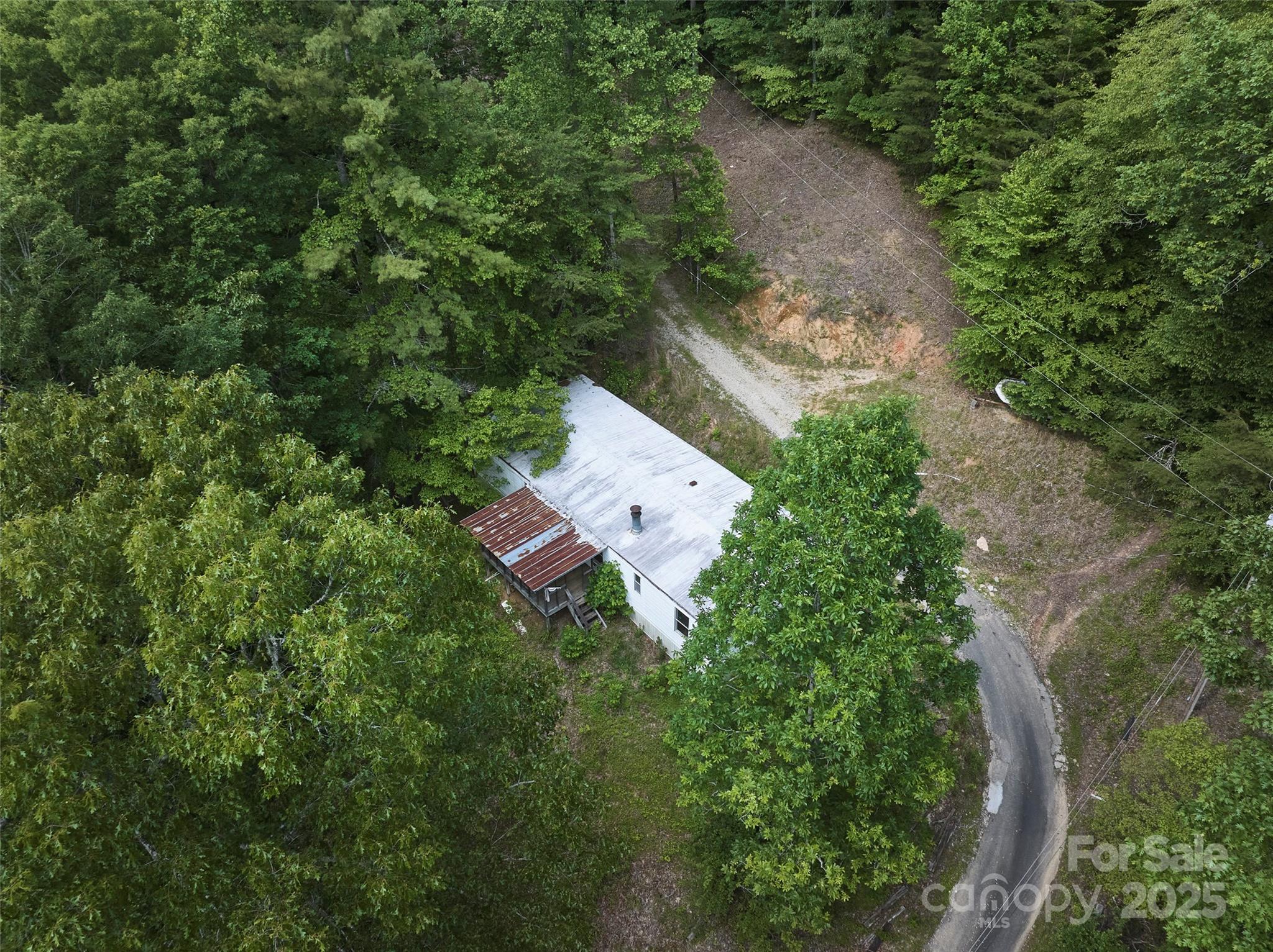 91 Keys Hill Road Almond, NC 28702 - Photo 14 of 19 an aerial view of a house with a yard and outdoor seating
