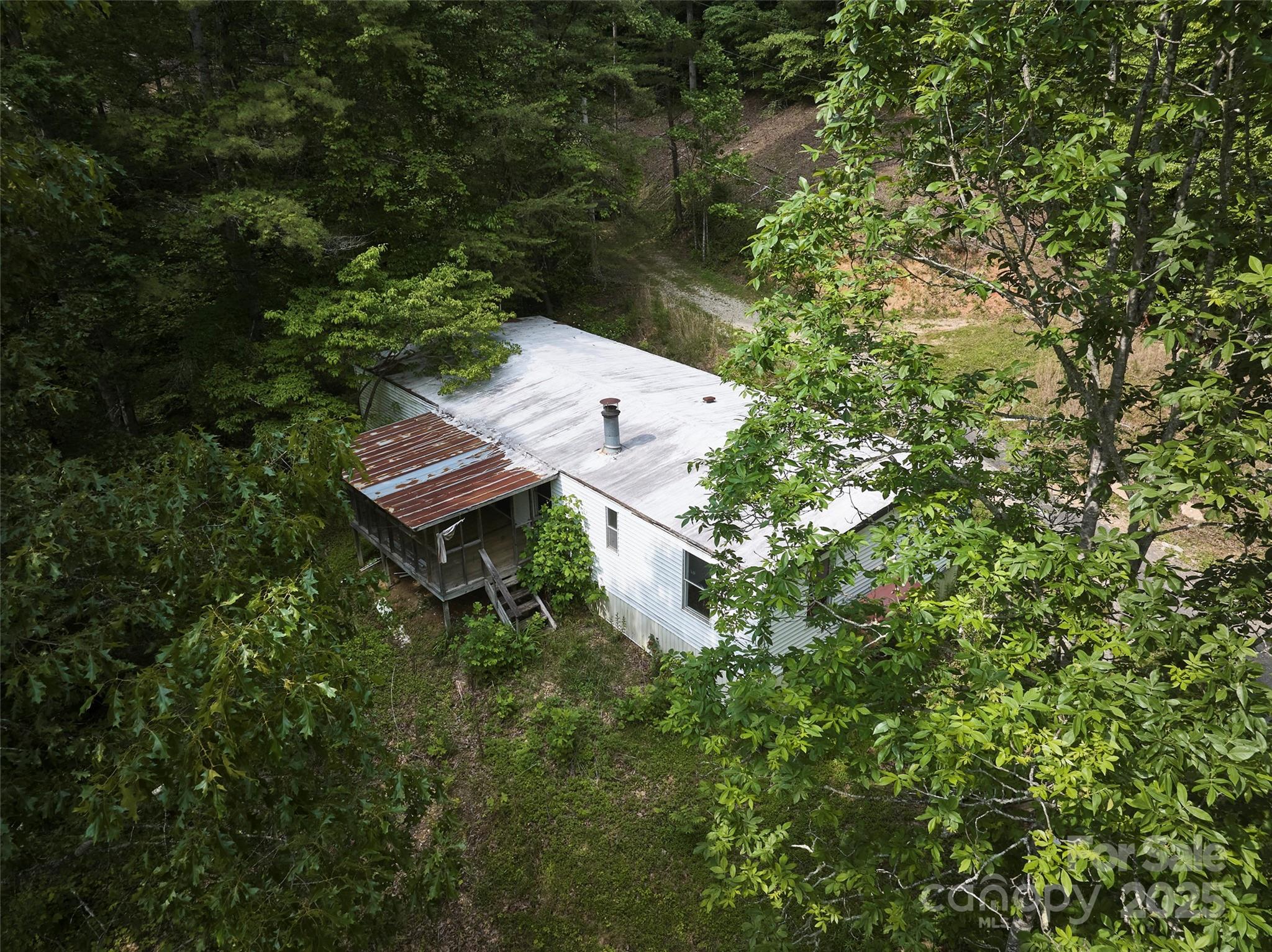 91 Keys Hill Road Almond, NC 28702 - Photo 17 of 19 a view of a house with a yard