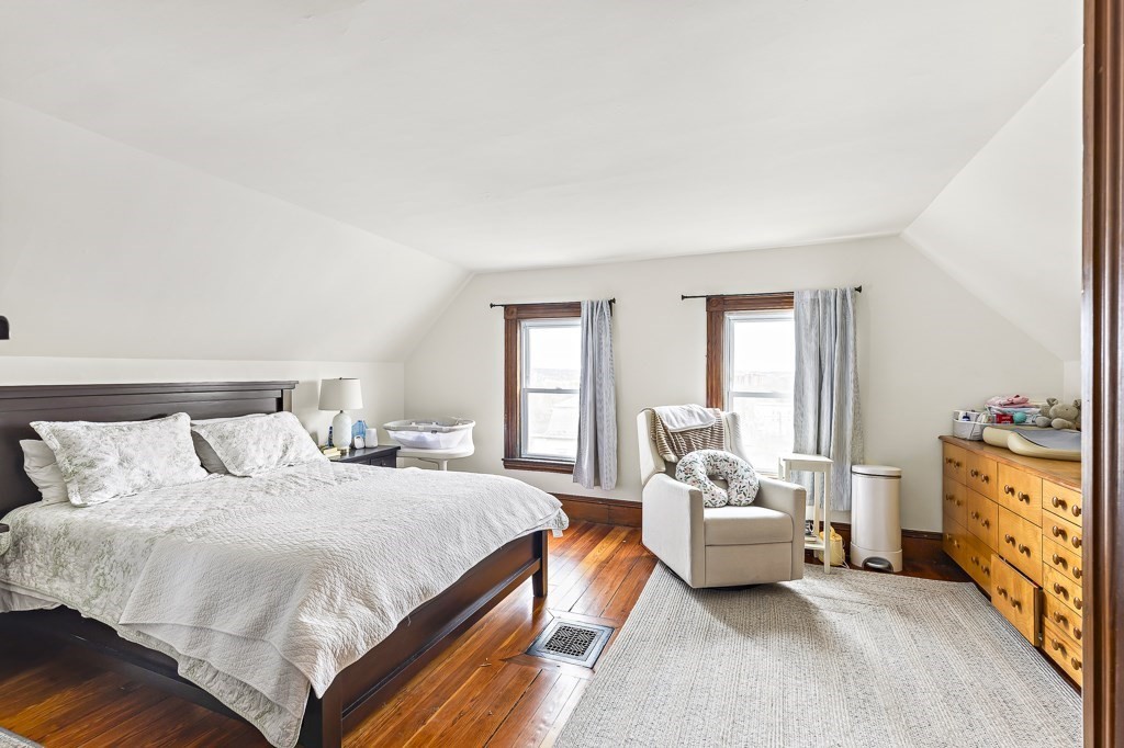 55 Main Street Somerville, MA 02145 - Photo 25 of 28 a bedroom with a bed and a couch