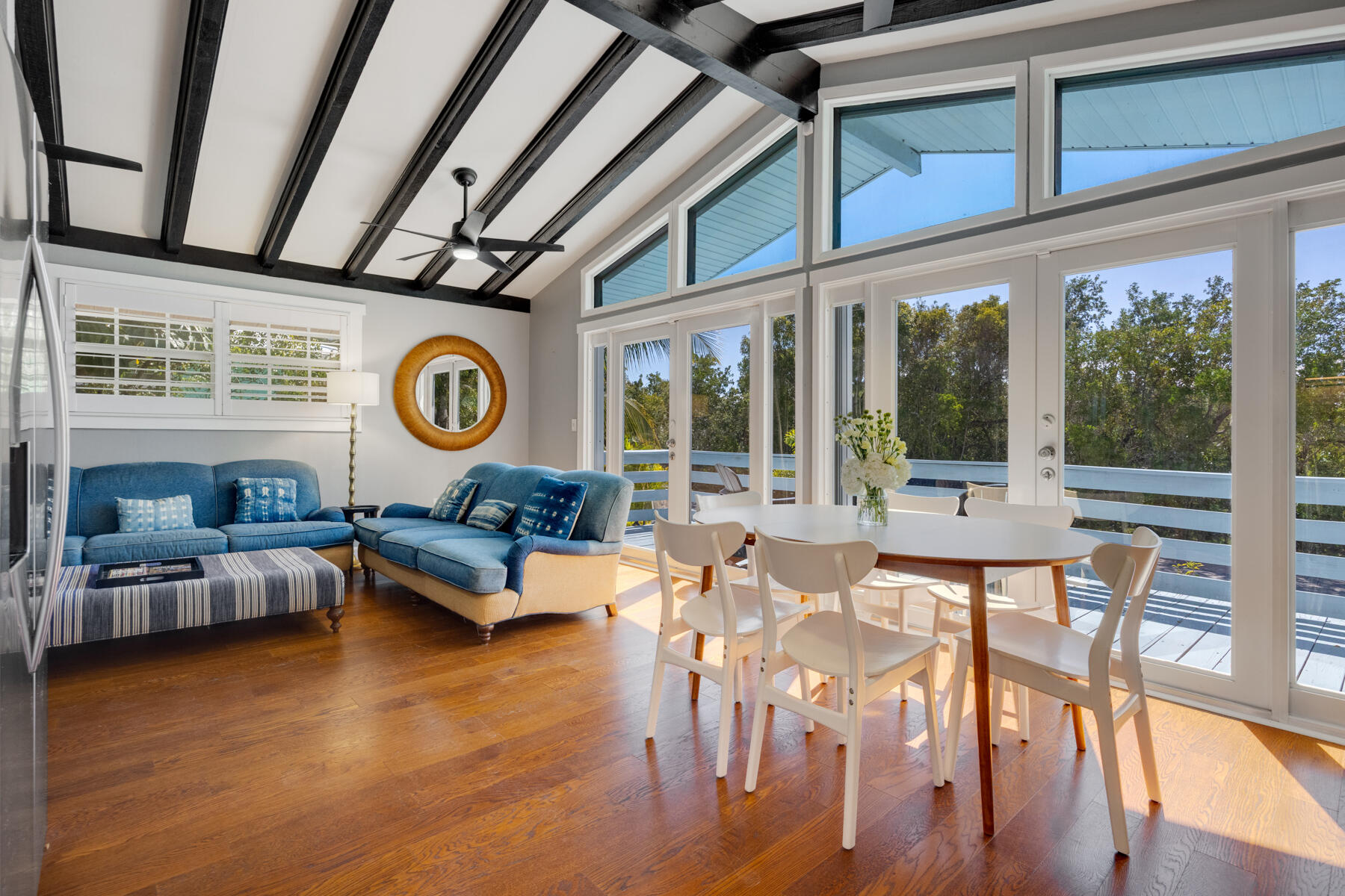 29961 Pine Channel Road Big Pine Key, FL 33043 - Photo 11 of 32 a living room with furniture and a large window