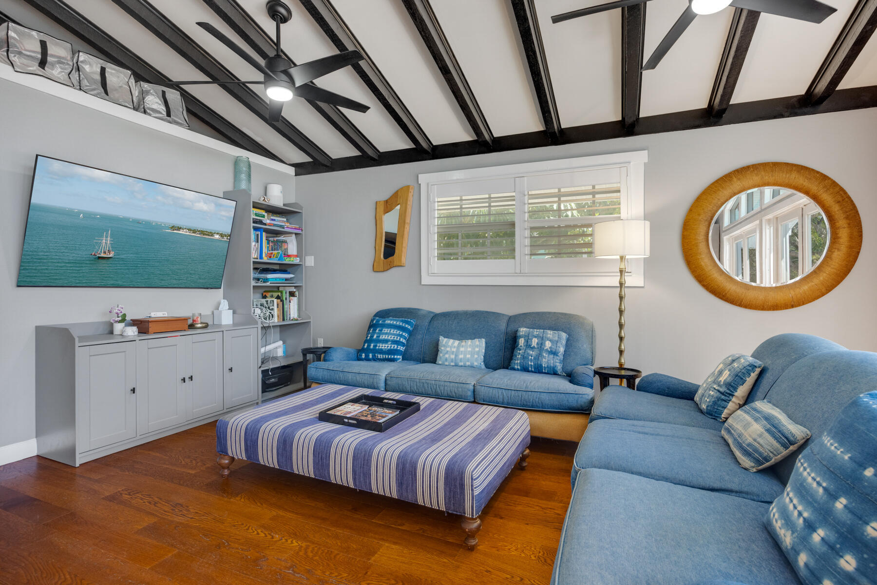 29961 Pine Channel Road Big Pine Key, FL 33043 - Photo 12 of 32 a living room with furniture and a flat screen tv
