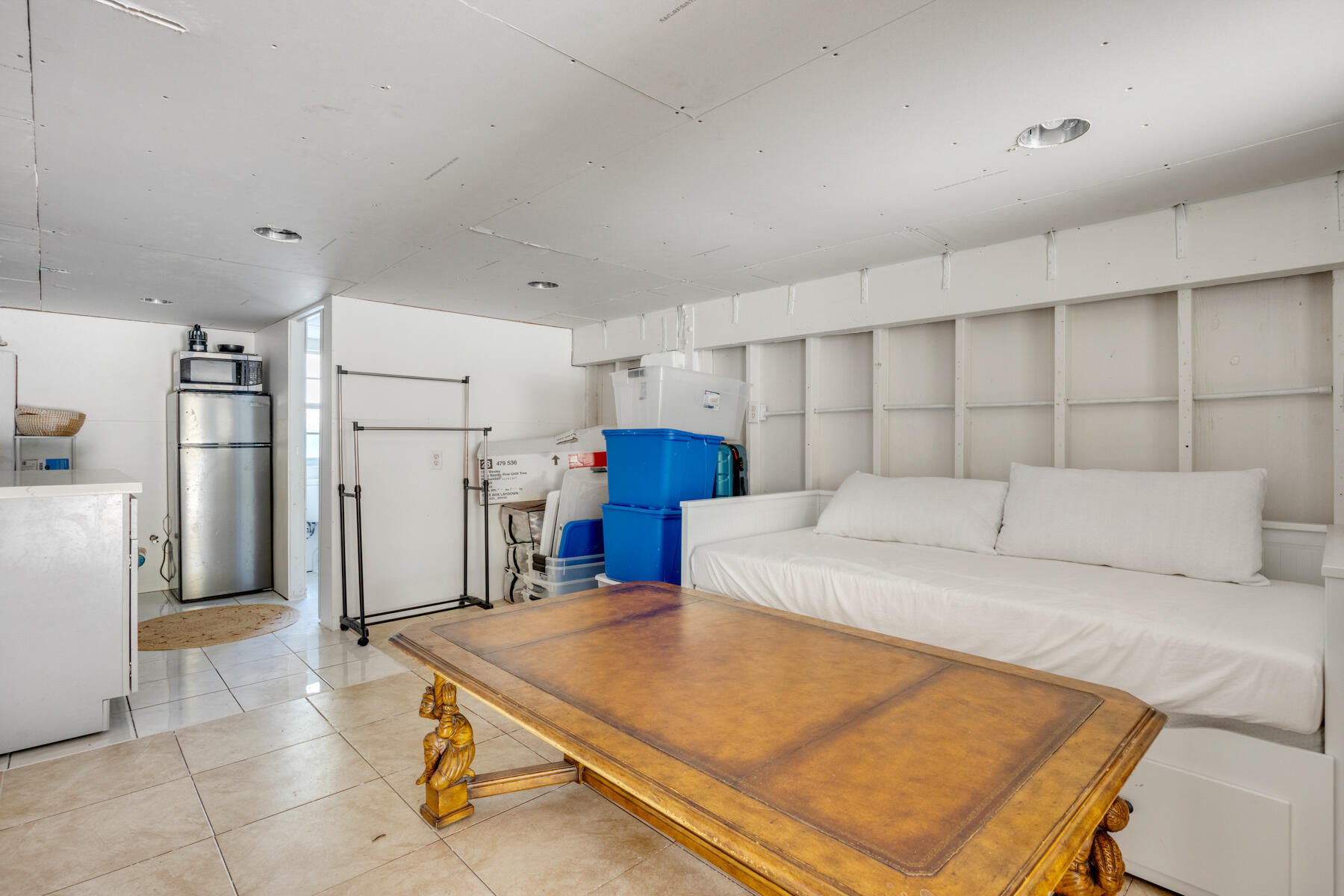 29961 Pine Channel Road Big Pine Key, FL 33043 - Photo 19 of 32 a room with a bed and a refrigerator