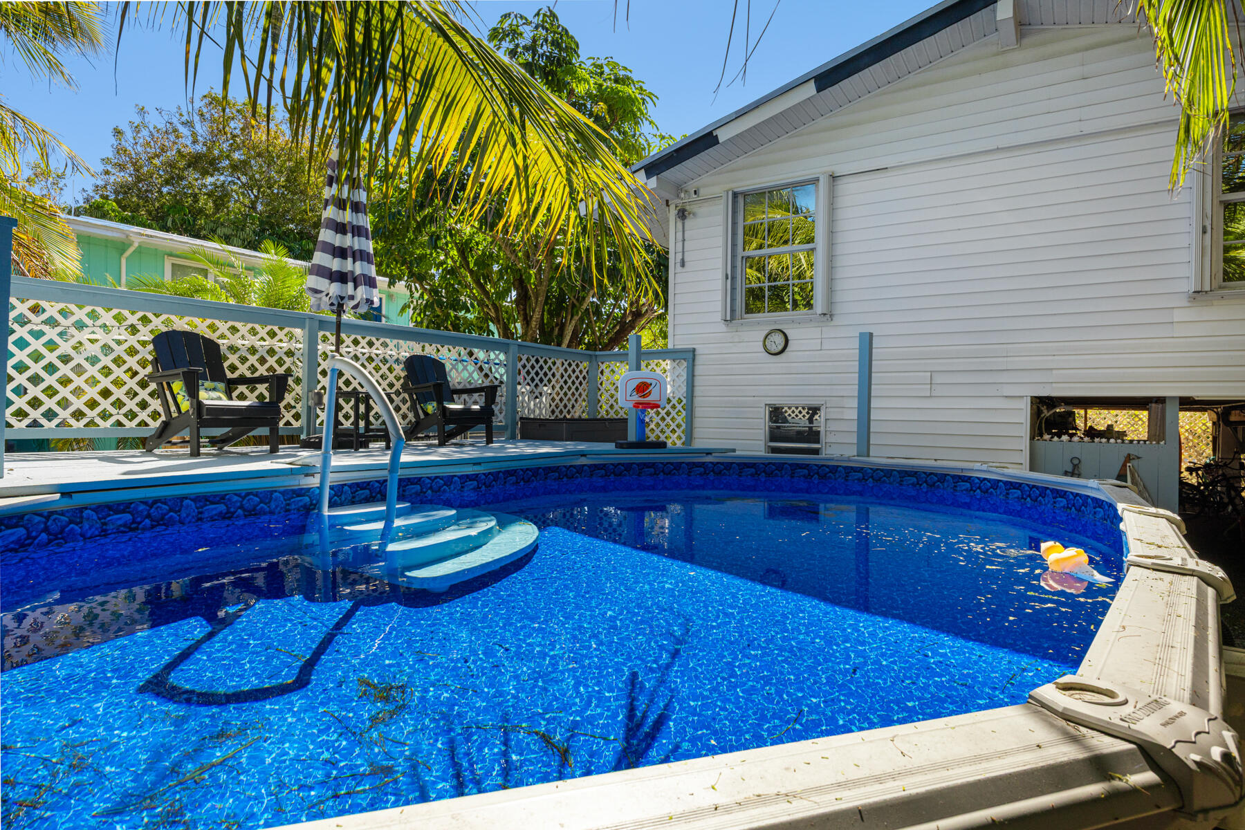 29961 Pine Channel Road Big Pine Key, FL 33043 - Photo 20 of 32 a view of a chairs and table in a patio