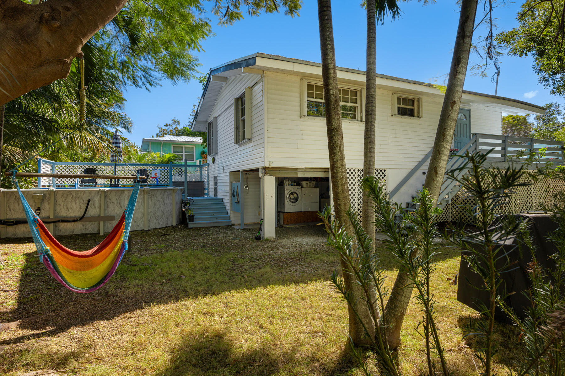 29961 Pine Channel Road Big Pine Key, FL 33043 - Photo 26 of 32 a view of a small house with a patio