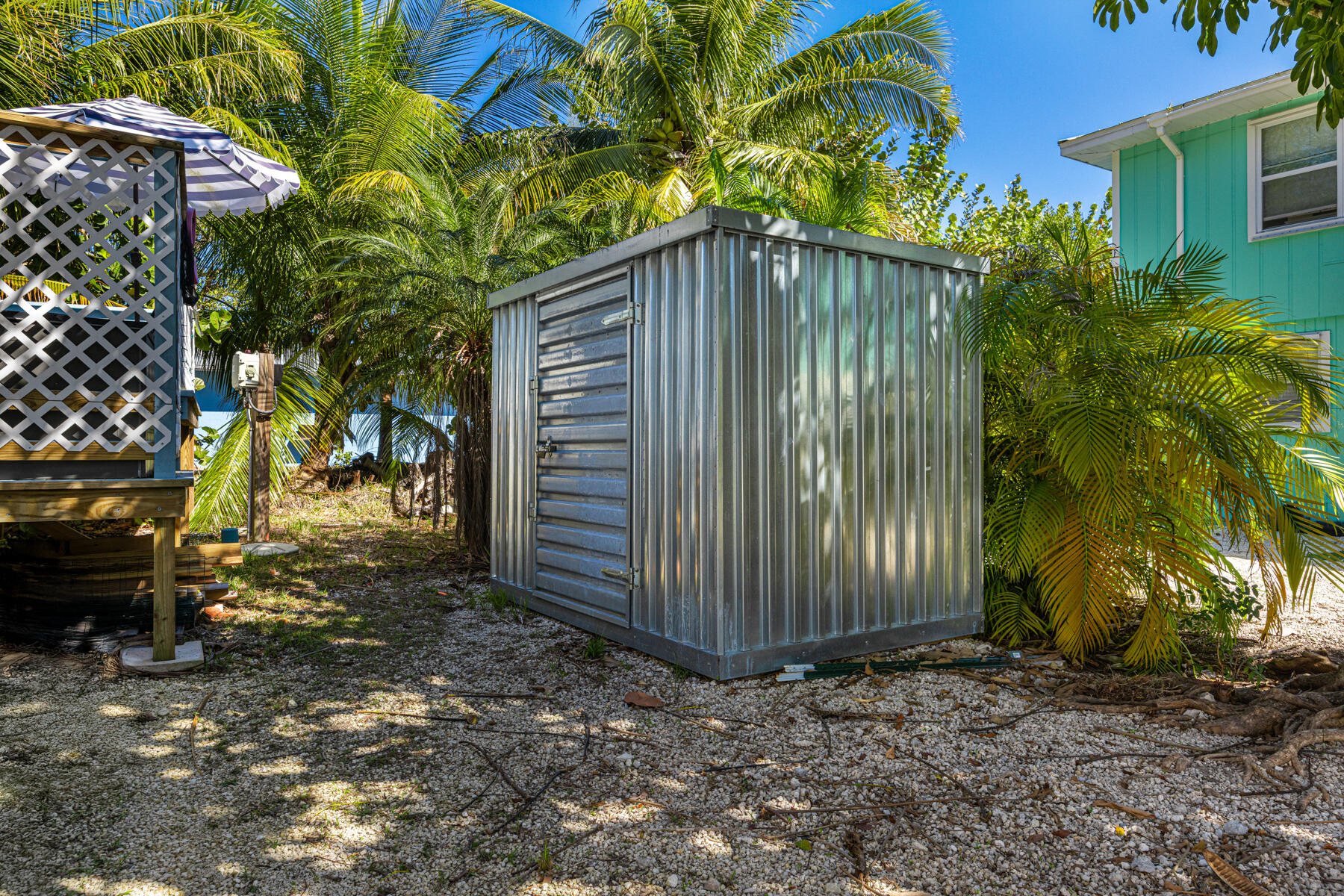 29961 Pine Channel Road Big Pine Key, FL 33043 - Photo 29 of 32 a backyard of a house with lots of green space