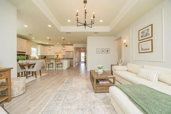 a bedroom with bed tv and a window