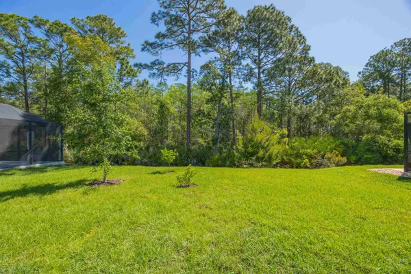 an aerial view of residential house with outdoor space and parking