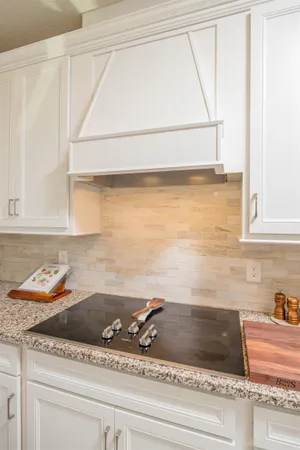 a kitchen with a counter space dining table and chairs