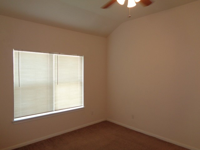 205 Maple Lane Conroe, TX 77304 - Photo 13 of 19 an empty room with a window