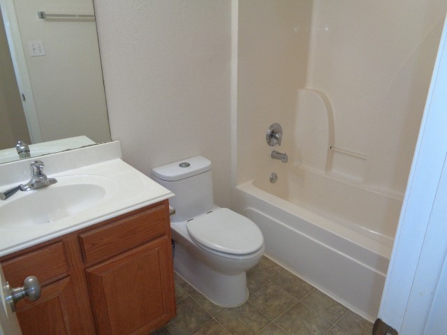 205 Maple Lane Conroe, TX 77304 - Photo 14 of 19 a bathroom with a sink toilet and shower