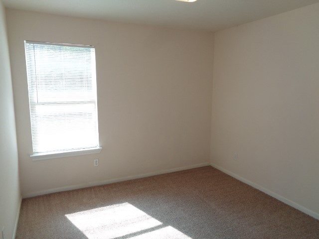 205 Maple Lane Conroe, TX 77304 - Photo 15 of 19 an empty room with a window