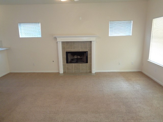 205 Maple Lane Conroe, TX 77304 - Photo 3 of 19 an empty room with a fireplace