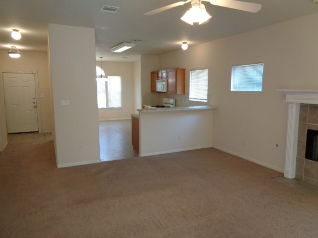 205 Maple Lane Conroe, TX 77304 - Photo 4 of 19 an empty room with windows and cabinet
