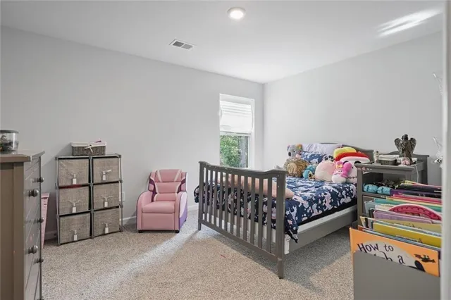a view of a livingroom with a baby crib