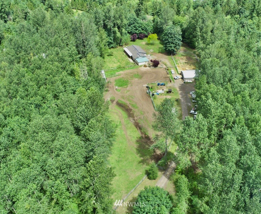 144 Morgan Road Toutle, WA 98649 - Photo 1 of 40 an aerial view of residential house with outdoor space and trees all around