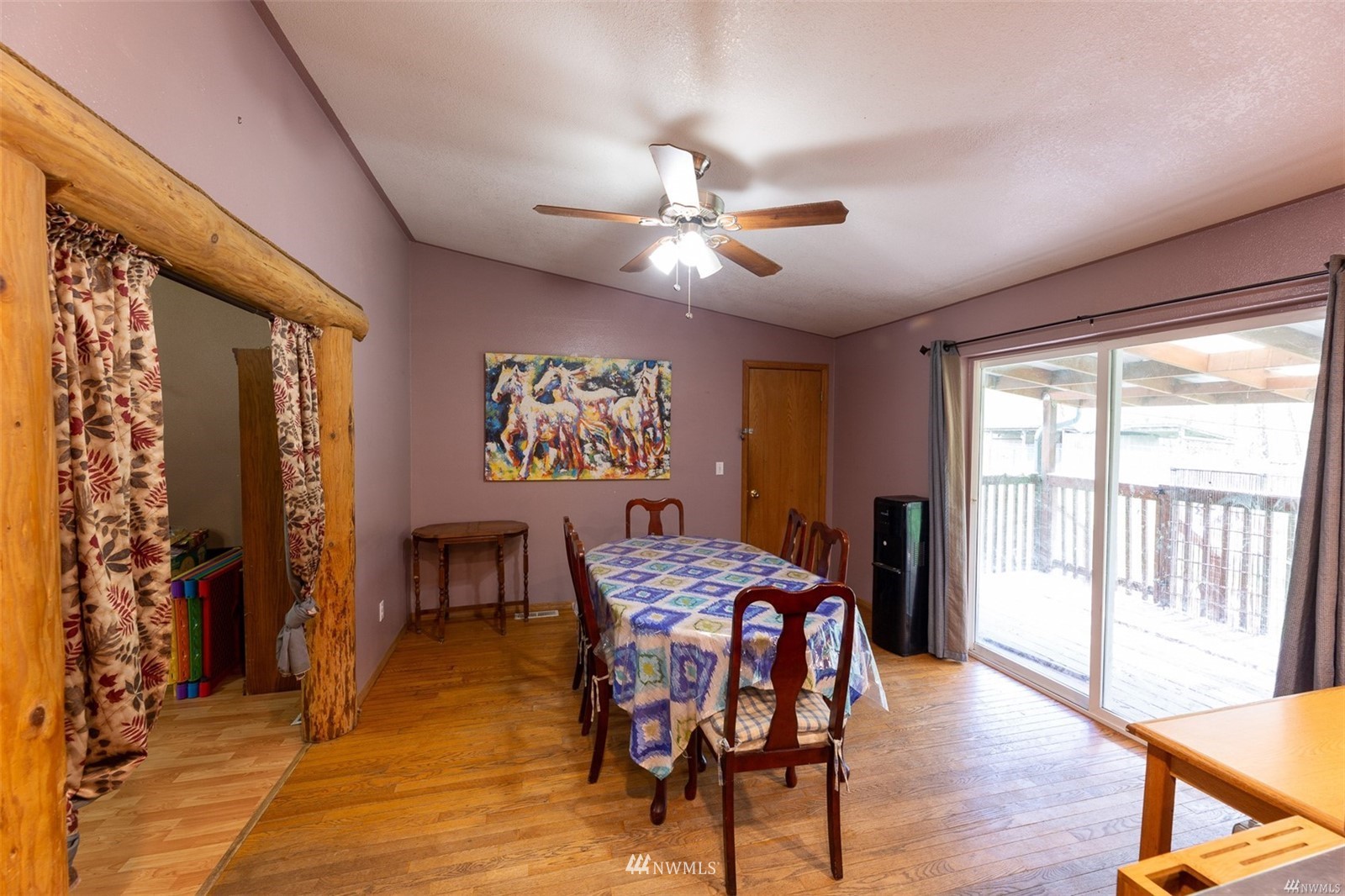 144 Morgan Road Toutle, WA 98649 - Photo 20 of 40 a dining room with furniture a chandelier and wooden floor