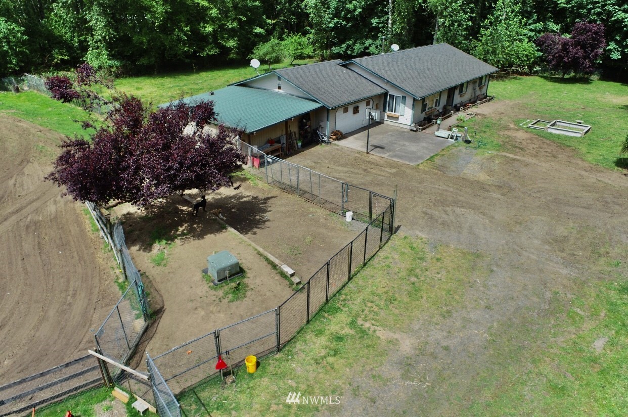 144 Morgan Road Toutle, WA 98649 - Photo 2 of 40 an aerial view of a house with backyard outdoor seating and green space