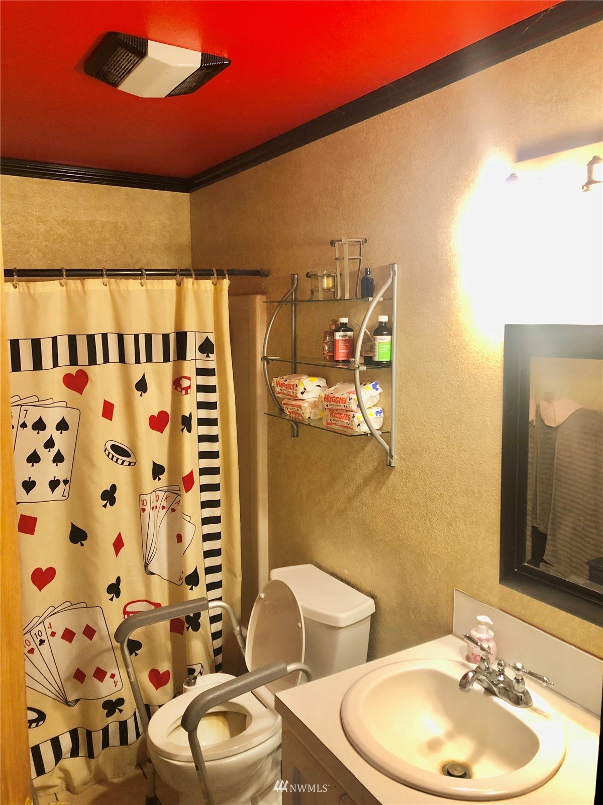 144 Morgan Road Toutle, WA 98649 - Photo 23 of 40 a bathroom with a toilet a sink and mirror