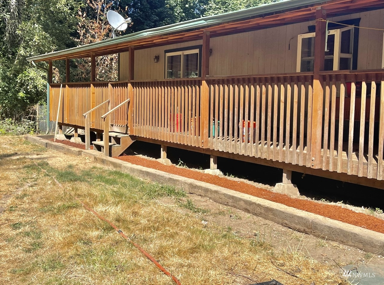 144 Morgan Road Toutle, WA 98649 - Photo 27 of 40 a view of a house with a wooden roof deck