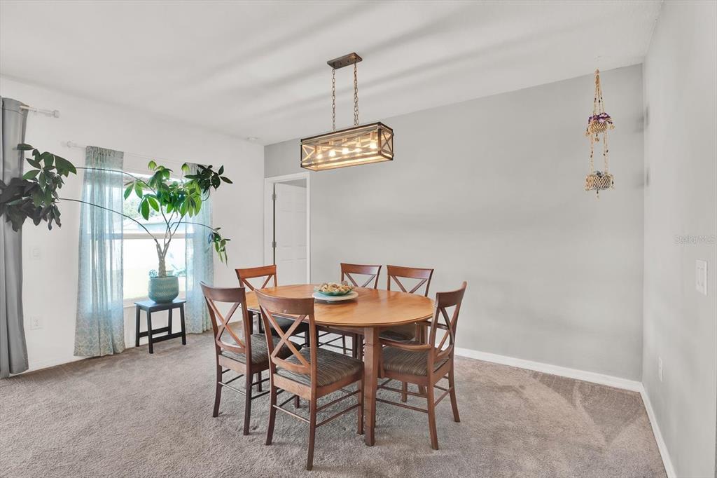12103 Gothic Rd Spring Hill Spring Hill, FL 34610 - Photo 11 of 44 a view of a dining room with furniture window and entryway
