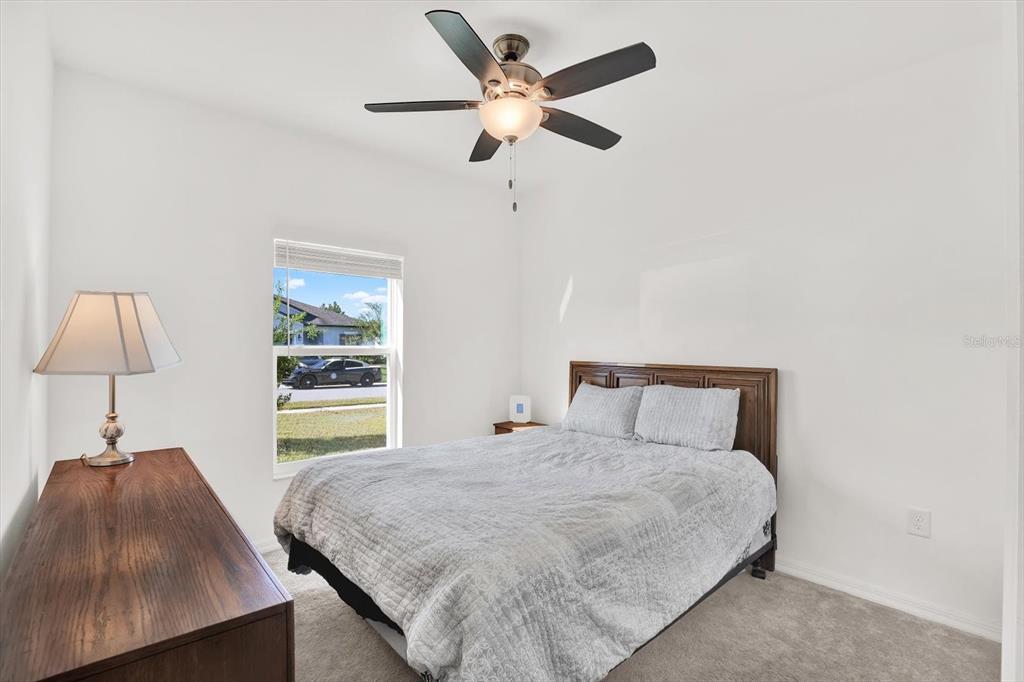12103 Gothic Rd Spring Hill Spring Hill, FL 34610 - Photo 18 of 44 a bedroom with a bed and a window