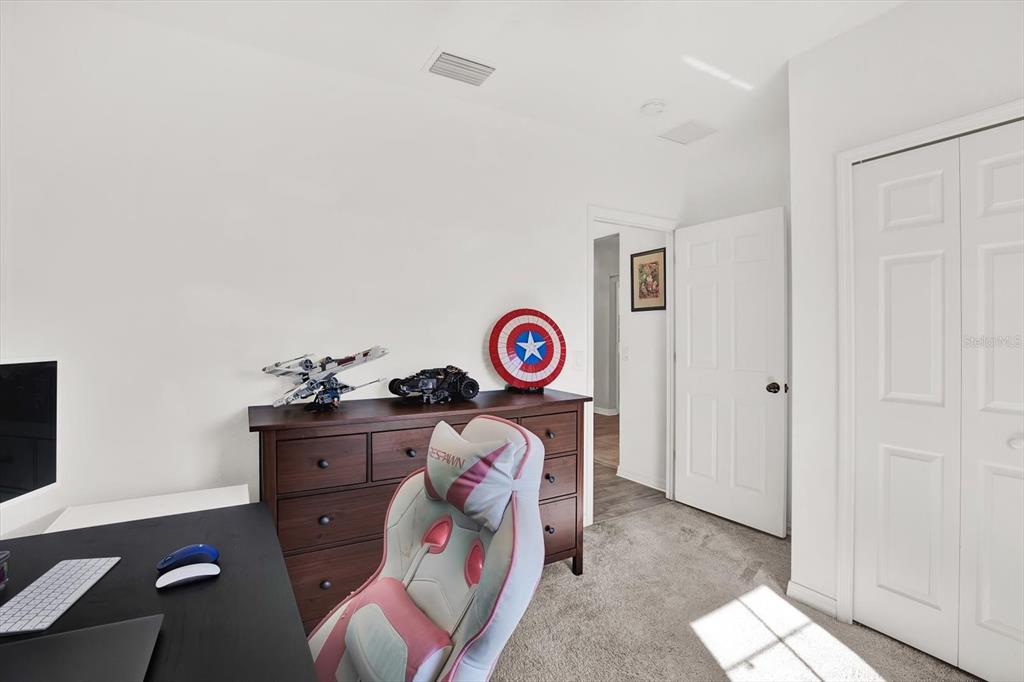 12103 Gothic Rd Spring Hill Spring Hill, FL 34610 - Photo 21 of 44 a bedroom with a bed and a window