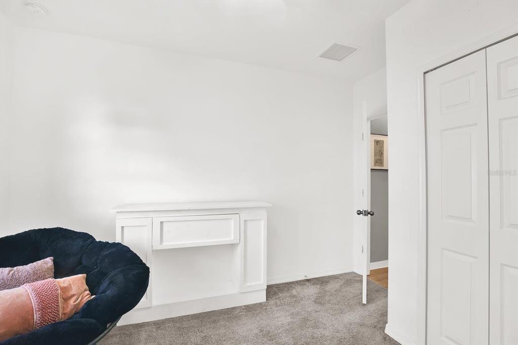12103 Gothic Rd Spring Hill Spring Hill, FL 34610 - Photo 24 of 44 a living room with furniture and a potted plant