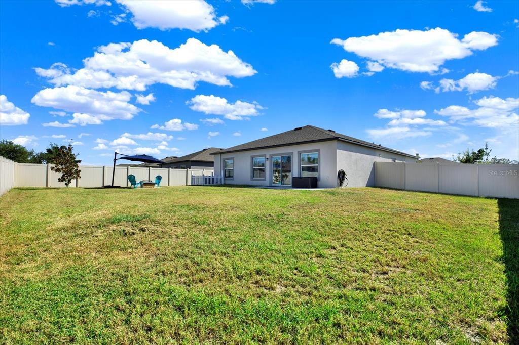 12103 Gothic Rd Spring Hill Spring Hill, FL 34610 - Photo 27 of 44 a front view of house with garden