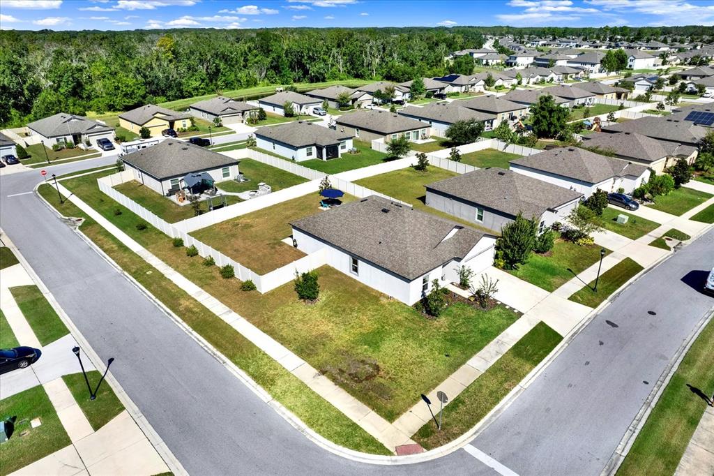 12103 Gothic Rd Spring Hill Spring Hill, FL 34610 - Photo 29 of 44 an aerial view of residential houses with outdoor space
