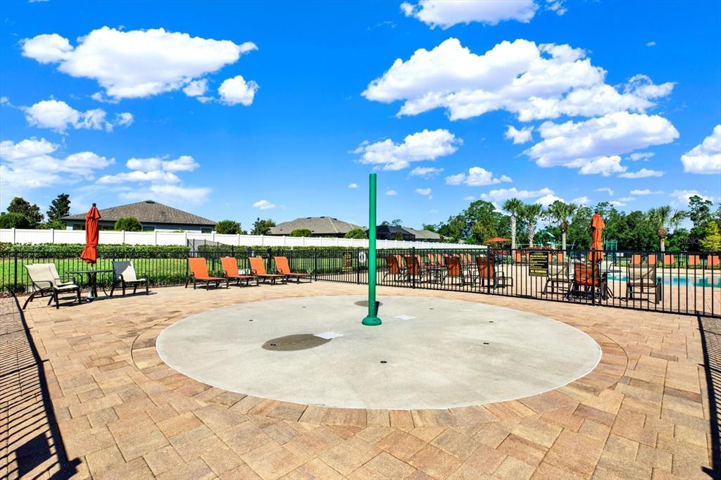 12103 Gothic Rd Spring Hill Spring Hill, FL 34610 - Photo 32 of 44 a swimming pool with outdoor seating and city view