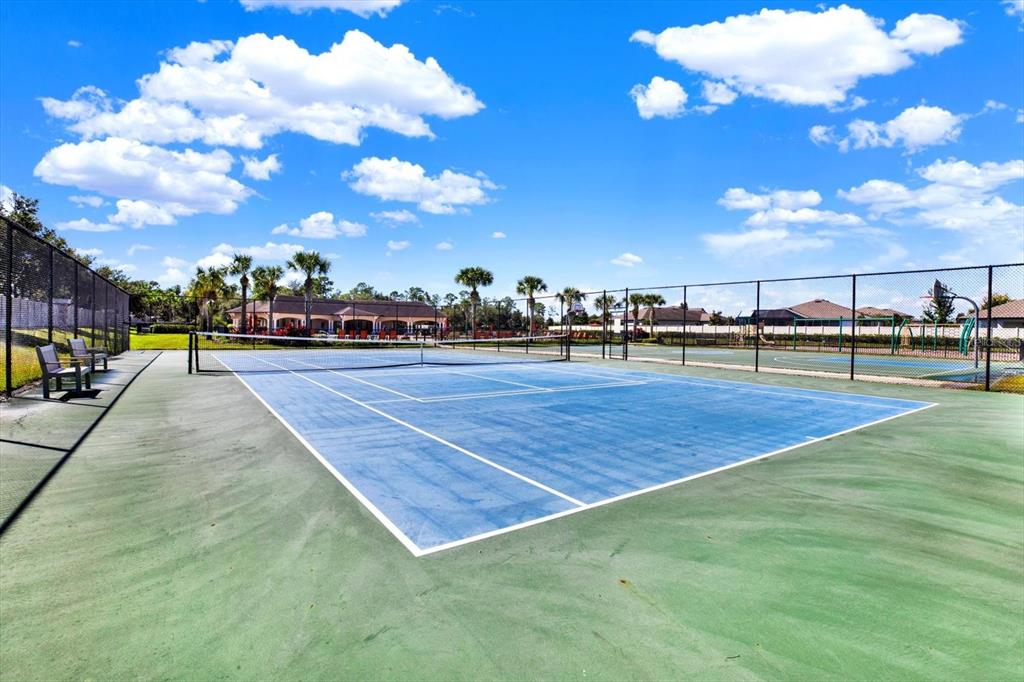 12103 Gothic Rd Spring Hill Spring Hill, FL 34610 - Photo 36 of 44 a swimming pool with an outdoor seating and a yard