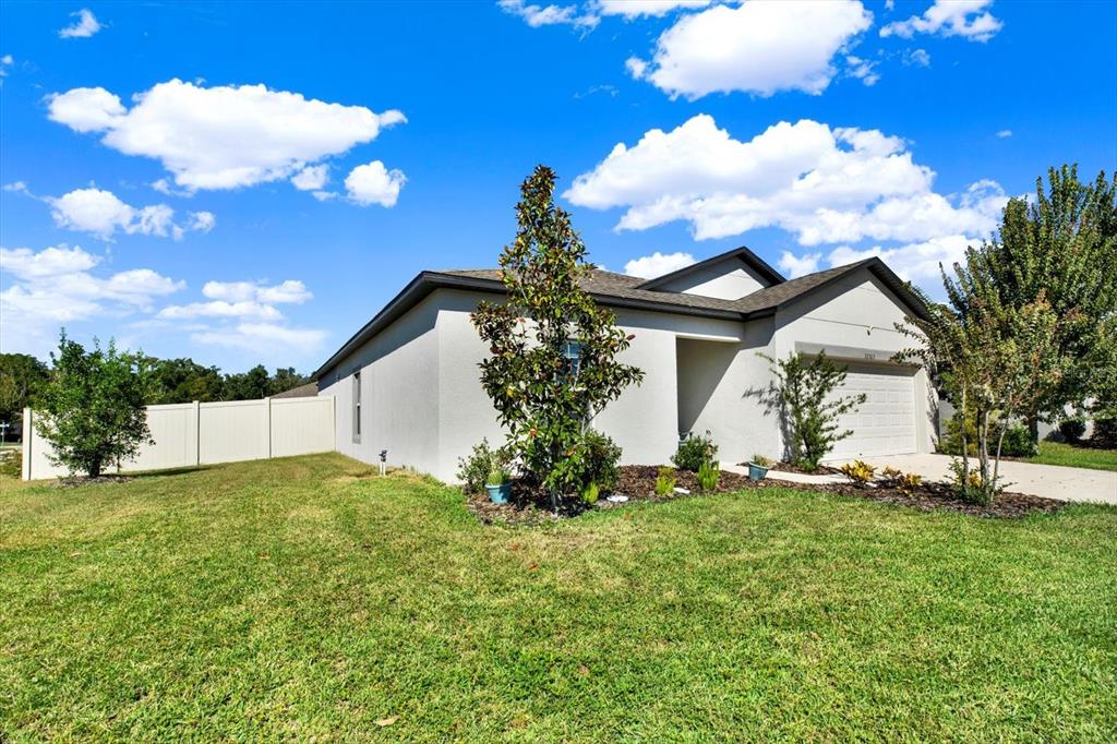 12103 Gothic Rd Spring Hill Spring Hill, FL 34610 - Photo 40 of 44 a view of a house with a big yard