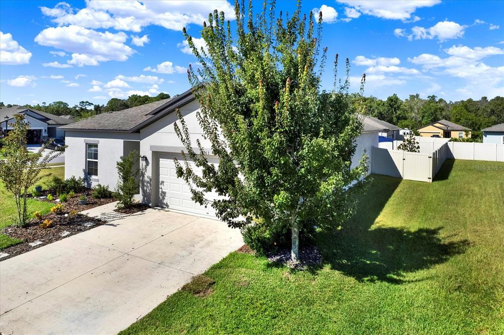 12103 Gothic Rd Spring Hill Spring Hill, FL 34610 - Photo 41 of 44 a view of a house with a yard and sitting area