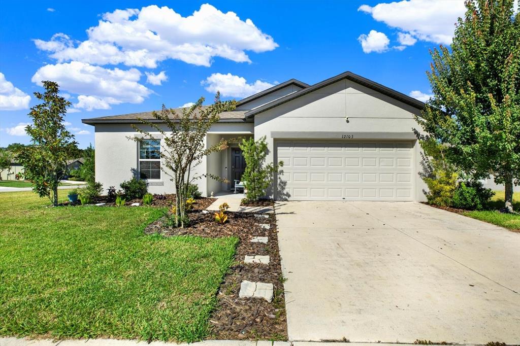 12103 Gothic Rd Spring Hill Spring Hill, FL 34610 - Photo 42 of 44 a front view of a house with garden