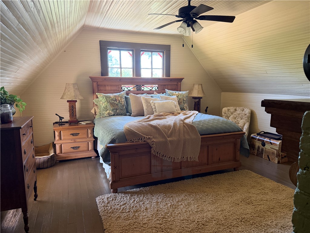 1100 Maple Calvert, TX 77837 - Photo 28 of 32 a bedroom with a bed and a chandelier