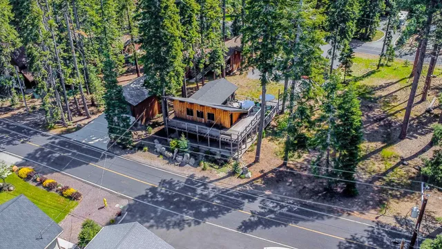 a view of a house with a tree in the background