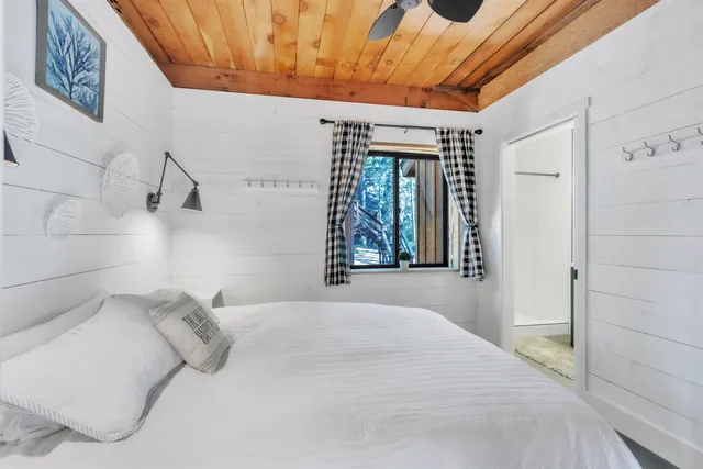 a bathroom with a sink a mirror and a shower