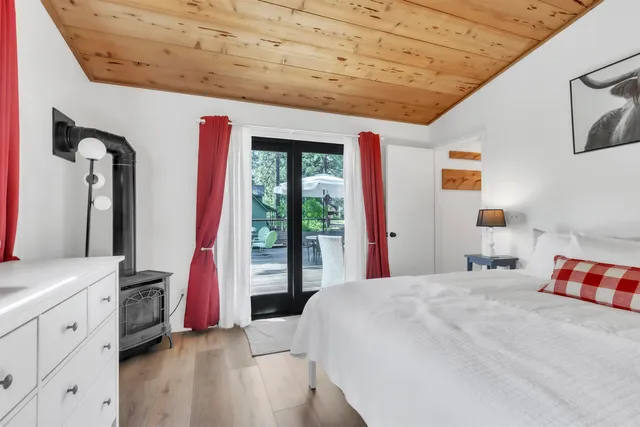 a view of balcony with chairs and wooden fence