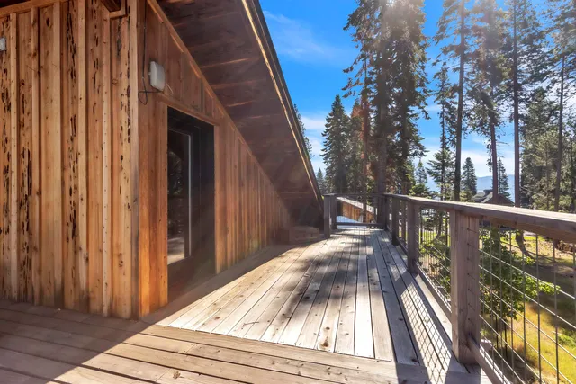 a view of a house with yard and sitting area