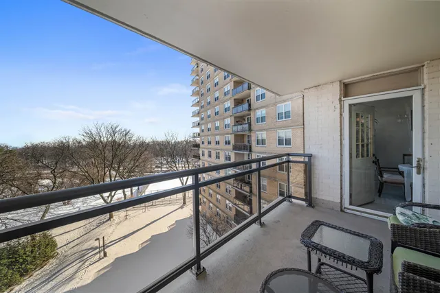 a view of balcony with furniture