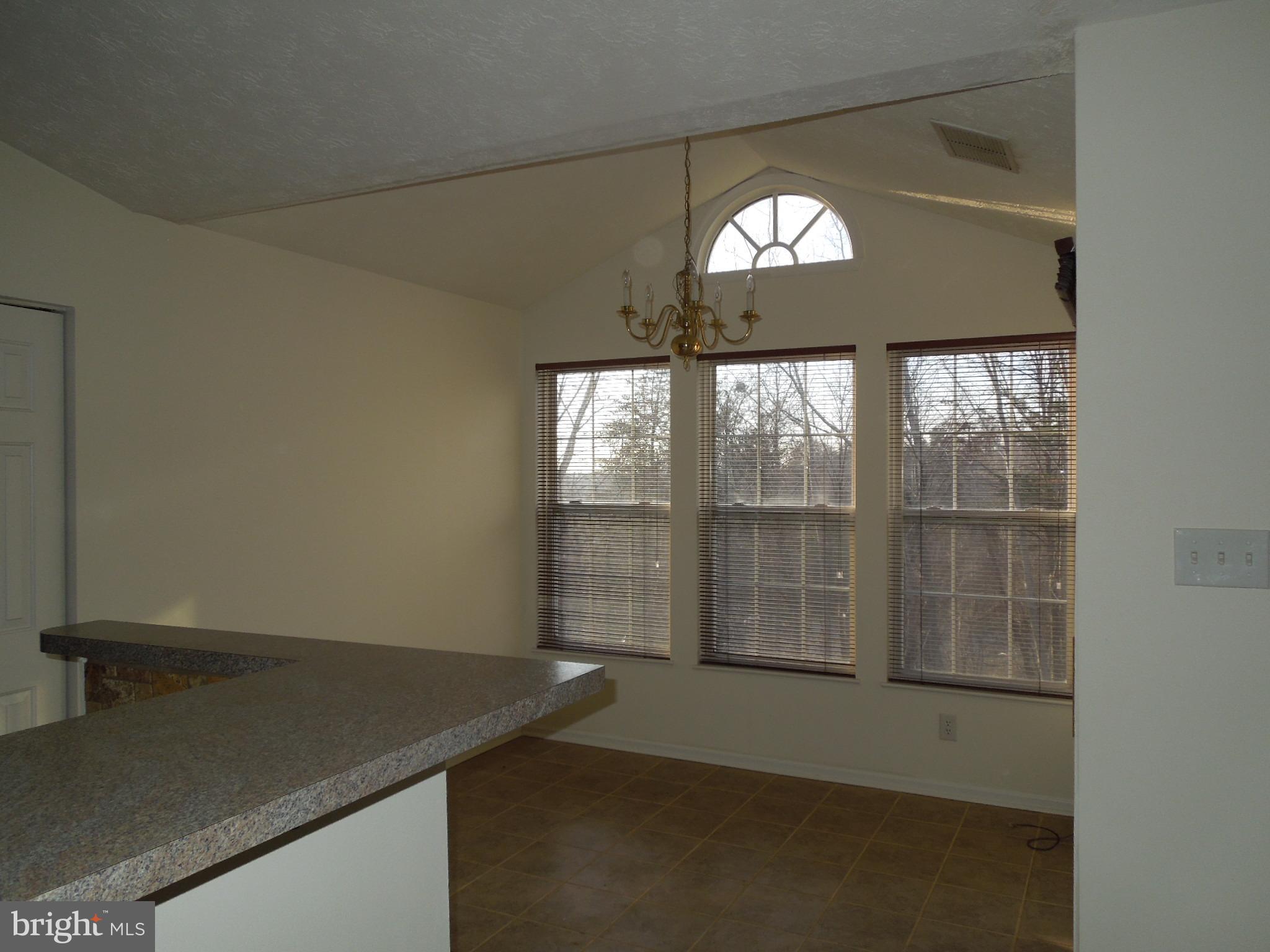 8233 Poplar Mill Road Baltimore, MD 21236 - Photo 8 of 20 Dining room with slider to balcony