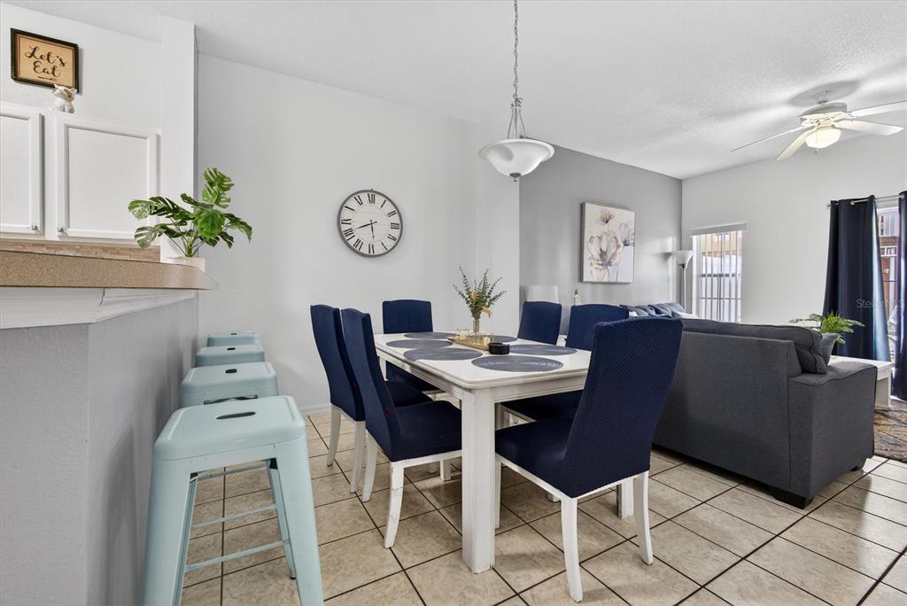 1066 Park Ridge Circle Kissimmee, FL 34746 - Photo 11 of 49 a view of a dining room with furniture