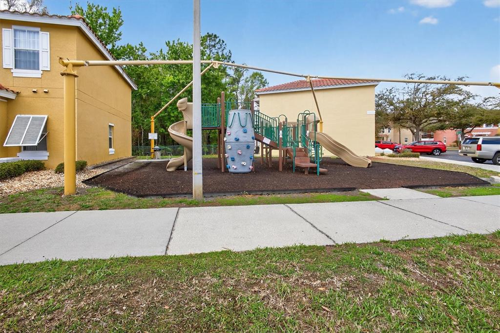 1066 Park Ridge Circle Kissimmee, FL 34746 - Photo 12 of 49 a view of a street with cars