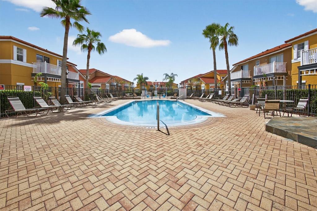 1066 Park Ridge Circle Kissimmee, FL 34746 - Photo 14 of 49 a swimming pool with outdoor seating and yard