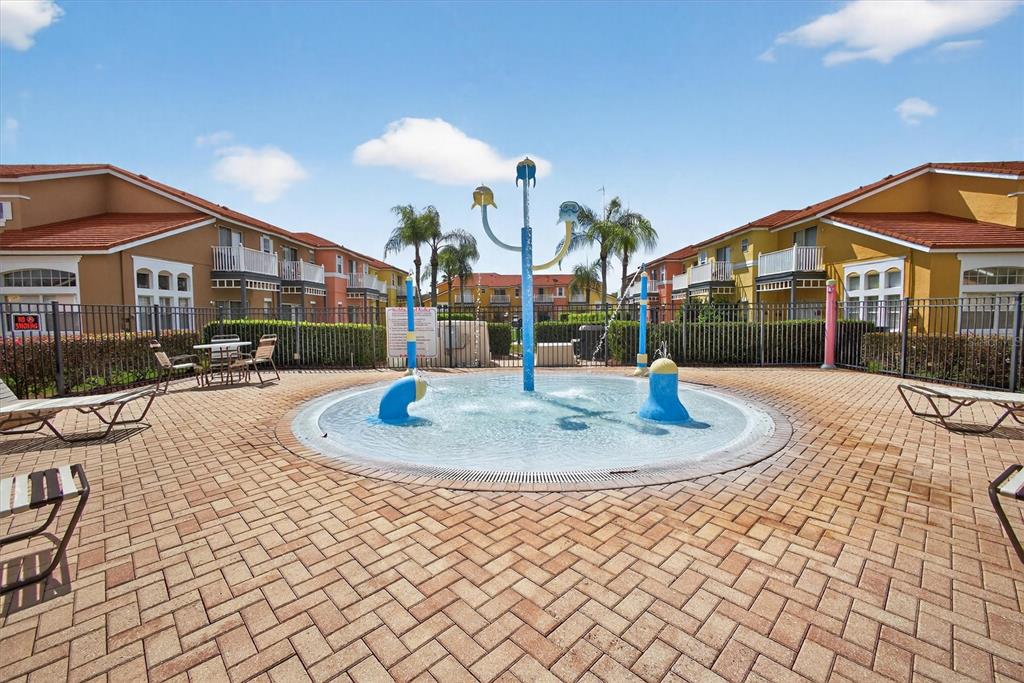 1066 Park Ridge Circle Kissimmee, FL 34746 - Photo 15 of 49 a front view of a house with a yard and trees