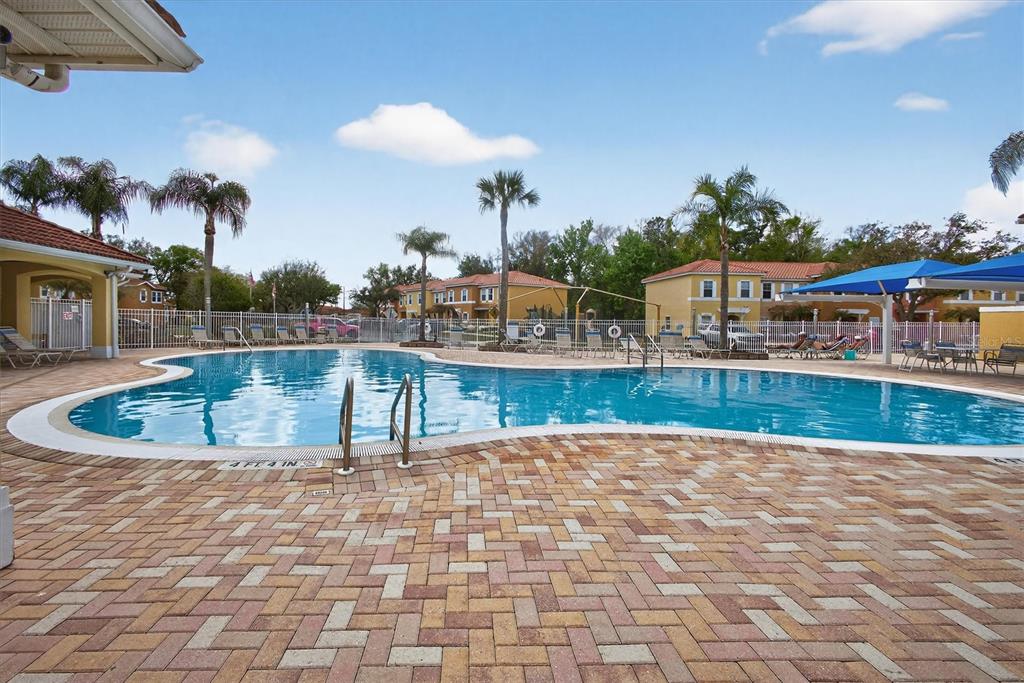 1066 Park Ridge Circle Kissimmee, FL 34746 - Photo 22 of 49 a view of a swimming pool with a patio