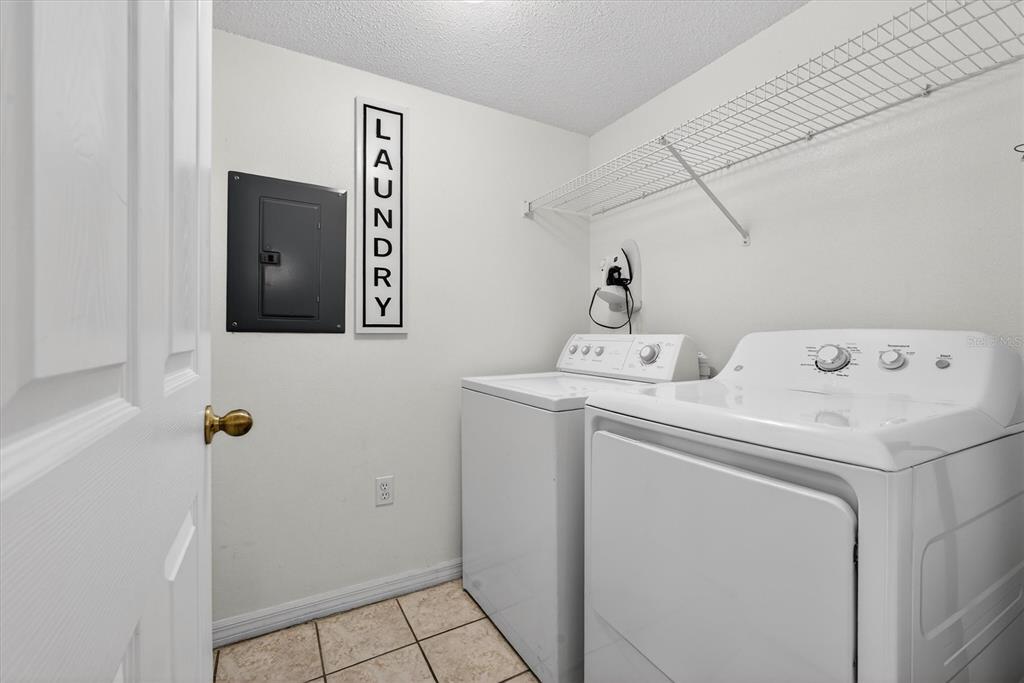 1066 Park Ridge Circle Kissimmee, FL 34746 - Photo 28 of 49 a utility room with dryer and washer