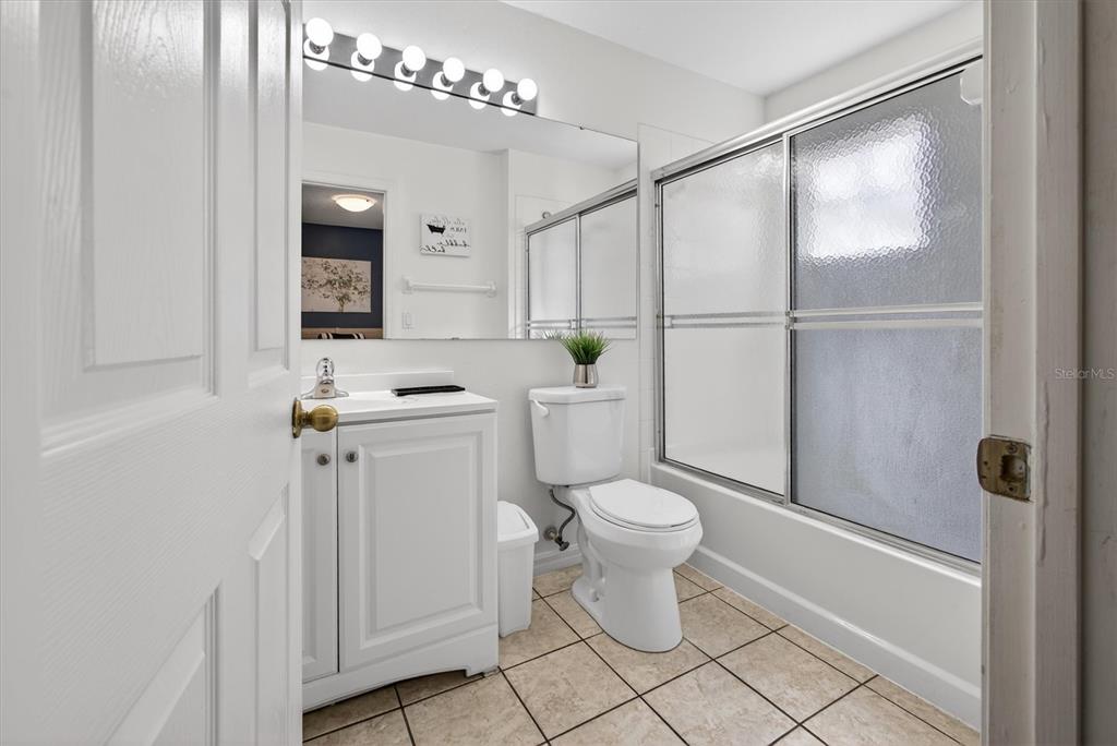 1066 Park Ridge Circle Kissimmee, FL 34746 - Photo 37 of 49 a white toilet sitting next to a bathroom sink