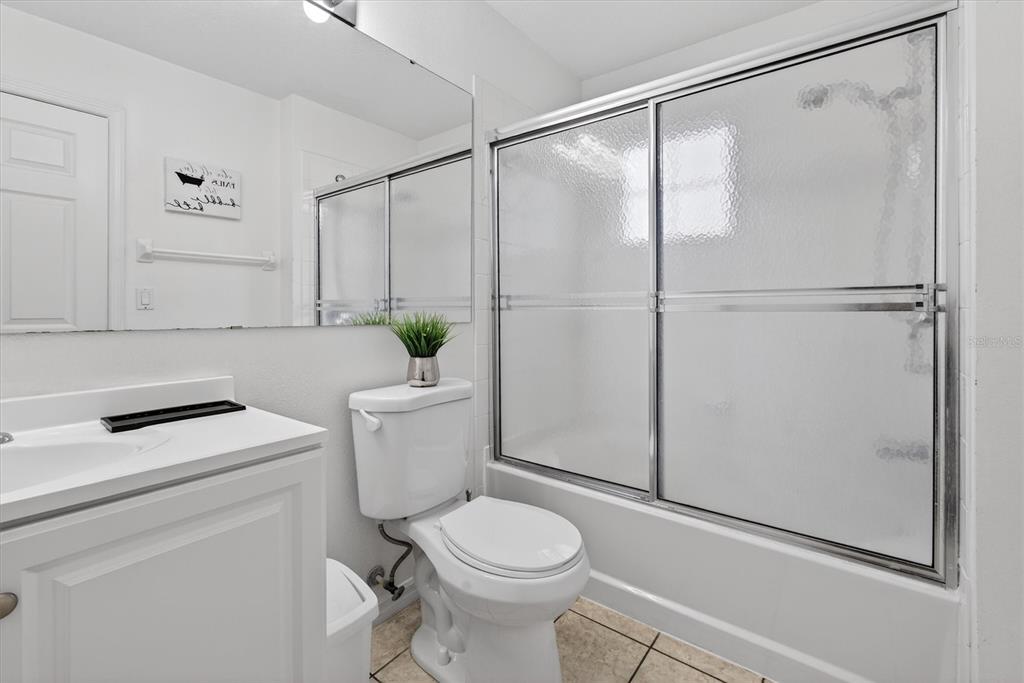 1066 Park Ridge Circle Kissimmee, FL 34746 - Photo 39 of 49 a white toilet sitting next to a bathroom sink