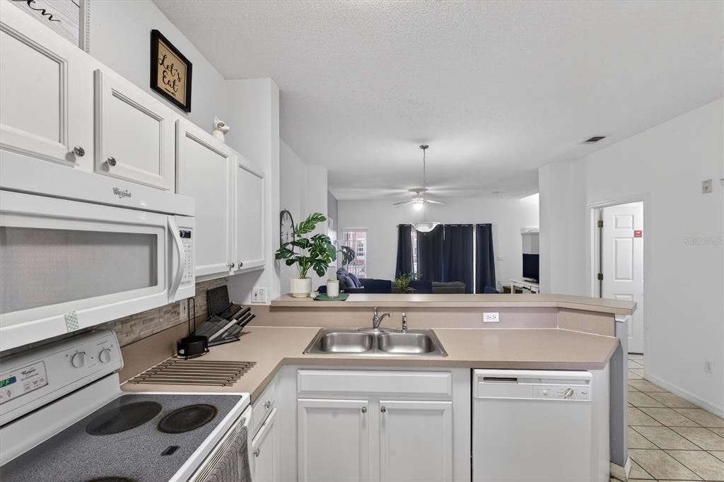 1066 Park Ridge Circle Kissimmee, FL 34746 - Photo 46 of 49 a bathroom with a sink and a mirror
